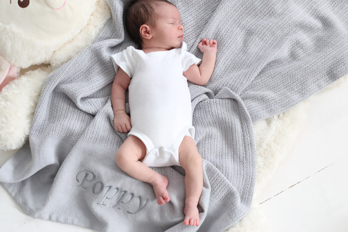 baby asleep on blanket