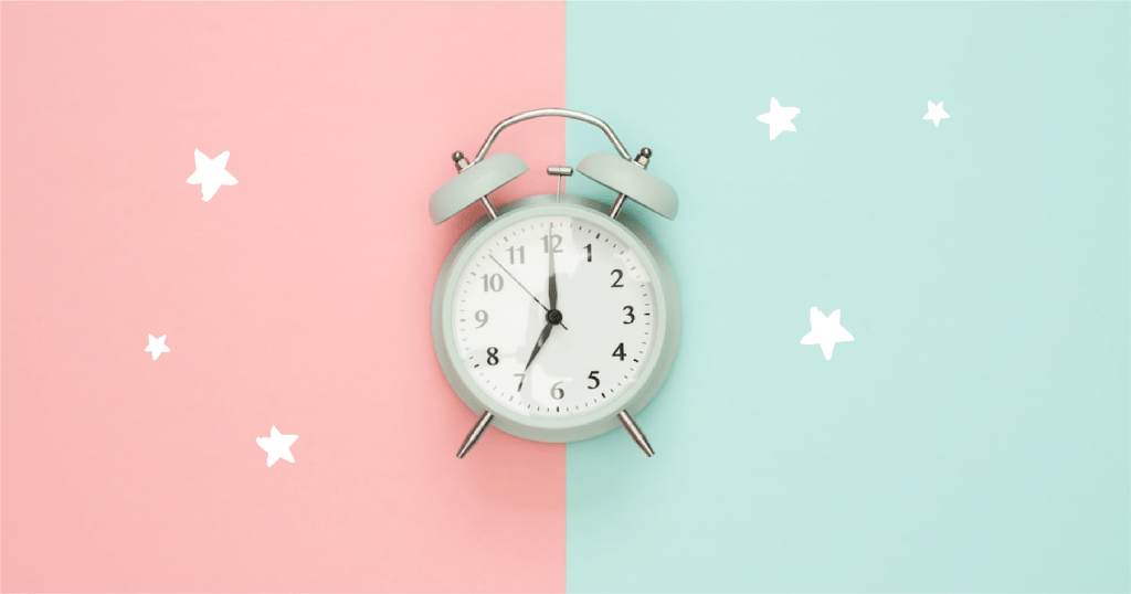 alarm clock with pink and blue background
