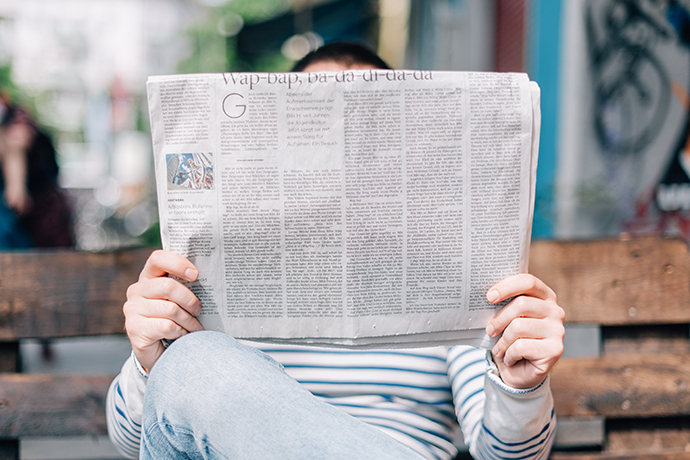 someone reading a newspaper